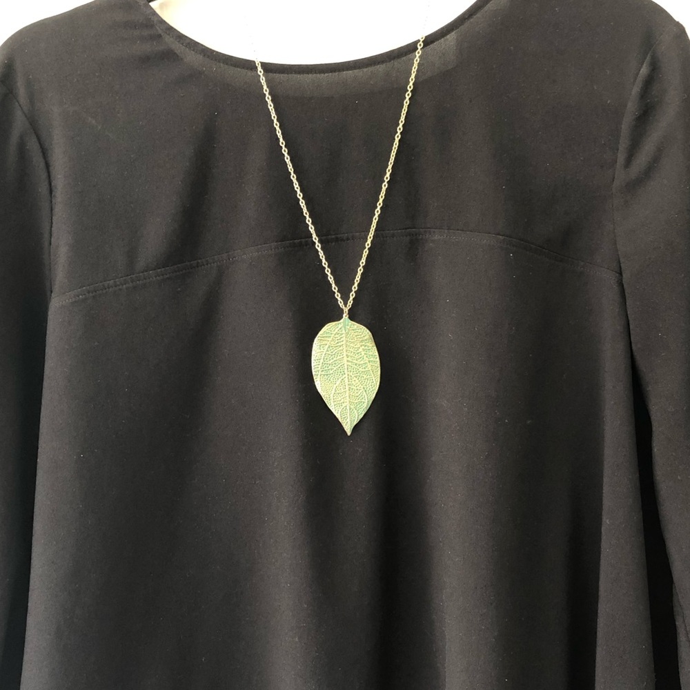 Leaf pendant on gold chain